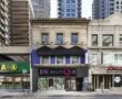 Upper floor office and retail space at 750 Yonge Street Toronto with street-level storefront and surrounding high-rise buildings
